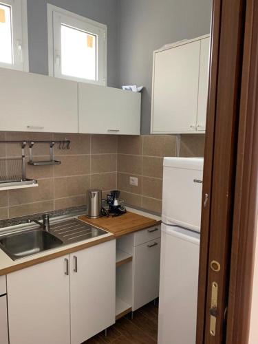 Η κουζίνα ή μικρή κουζίνα στο Alessia's Flat - Affori