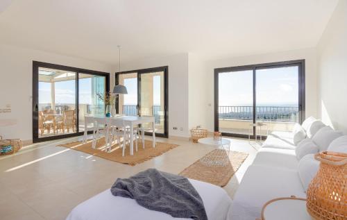 a living room with a white couch and a table at Luxurius Penthouse with Large Terrace and Spa in Marbella