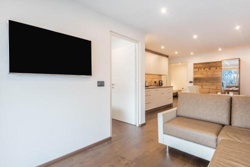 Télévision ou salle de divertissement dans l'établissement Apartment La Rodra