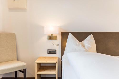 Un ou plusieurs lits dans un hébergement de l'établissement Apartment La Rodra