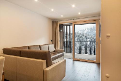Coin salon dans l'établissement Apartment La Rodra