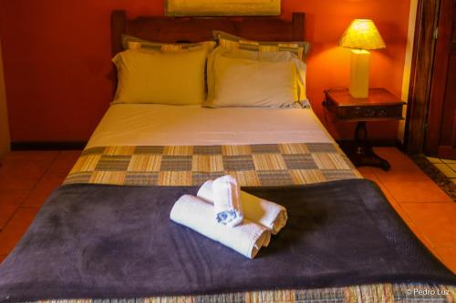Postel nebo postele na pokoji v ubytování Hotel Chalés Terra Nova