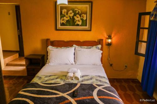 Postel nebo postele na pokoji v ubytování Hotel Chalés Terra Nova