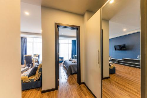 a view of a room with a bedroom and a living room at Sani Apart Hotel in Tbilisi City