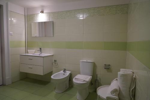 a bathroom with a toilet and a sink at DS Apartment in Catania