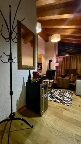 a living room with a mirror and a table at Apartmány iziJasná & Chalets in Demanovska Dolina