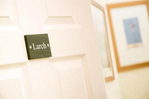 a door with a sign that says l garden on it at Willowbeck Lodge Boutique Hotel in Carlisle