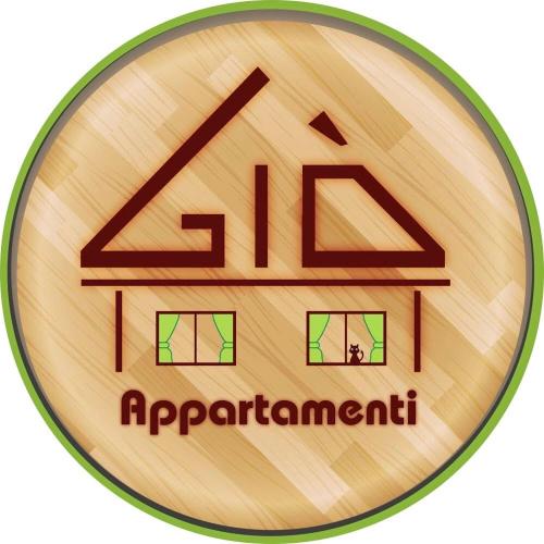 a wooden medal with the name of an organization at Giò Appartamenti Vacanze in Aymavilles