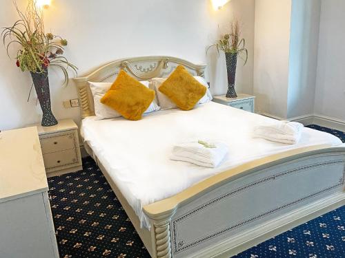 Ένα ή περισσότερα κρεβάτια σε δωμάτιο στο The President Hotel