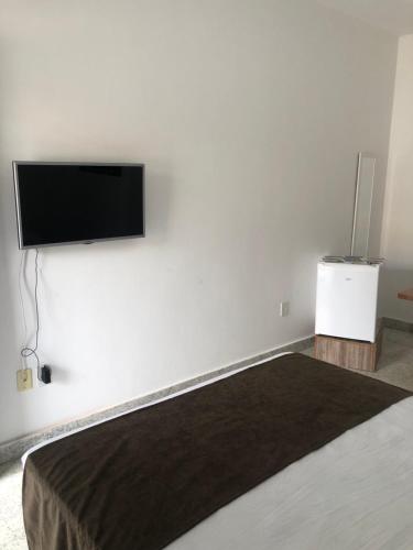 TV a/nebo společenská místnost v ubytování Pousada Central-Ubajara Capital do Turismo