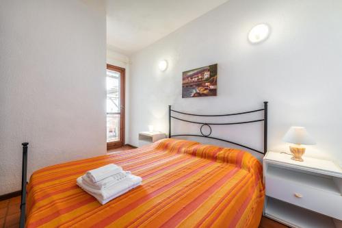 Postel nebo postele na pokoji v ubytování Accu is Prezzus C fronte mare