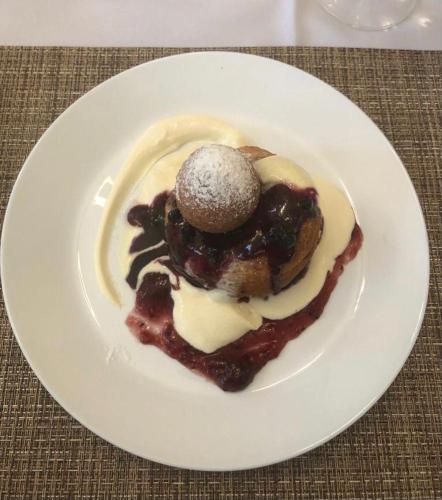 a white plate with a dessert on a table at Montebello in Predeal