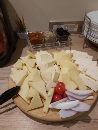 a plate of cheese and tomatoes on a table at Montebello in Predeal
