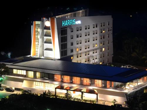 a hotel building with a harris inn sign on it at HARRIS Hotel Sentul City Bogor in Bogor