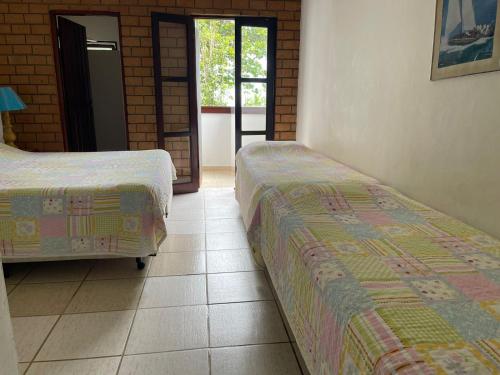 Barequeçaba Praia Hotelにあるベッド