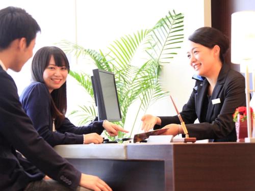 a group of people sitting at a desk at Richmond Hotel Fukushima Ekimae in Fukushima