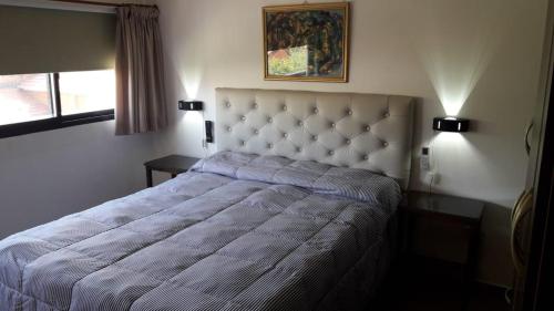 Uma cama ou camas num quarto em Maganal