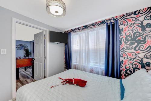 a red dog laying on a bed in a bedroom at Mermaid-Shark 6BR House With Pool, Jacuzzi - Steps to Siesta Key Beach in Siesta Key