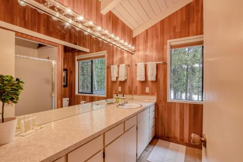 a bathroom with a sink and a large mirror at Golf Home 53 in Black Butte Ranch
