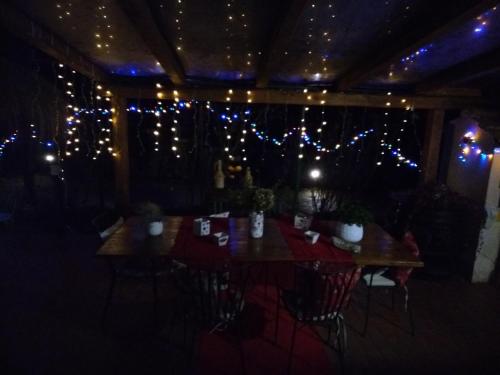 a dining room with christmas lights on the ceiling at Petalo Rosso b&b in Lenola