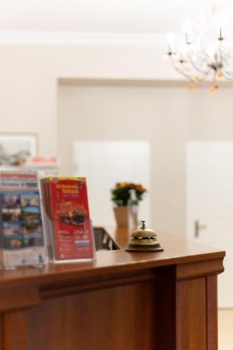 a counter top with a book and a pot on it at Budapest Panorama Central in Budapest