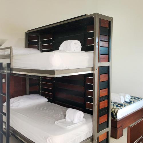 a group of bunk beds in a room at La Bocana de Quiximies Hotel in Cojimíes