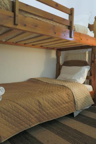 a bunk bed in a room with a bunk bedutenewayangering at Country Home Giannaras in Piána