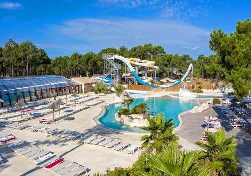 a resort with a water park with a roller coaster at Mobil home 6 Personnes au Atlantic Club Montalivet in Vendays-Montalivet