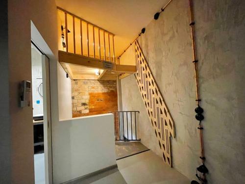 a hallway with a staircase in a house at König Albert Industrie Loft in Bitterfeld