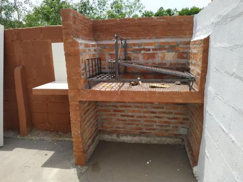 a brick wall with a bench on top of it at Casita de Piedra 6 in Trinidad