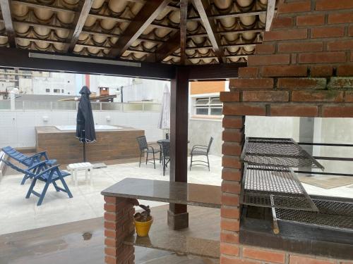 Balkón nebo terasa v ubytování Cobertura Guarujá Apto com Jacuzzi e Churrasqueira