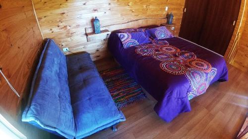 Ένα ή περισσότερα κρεβάτια σε δωμάτιο στο Cabañas Sol de Aucar