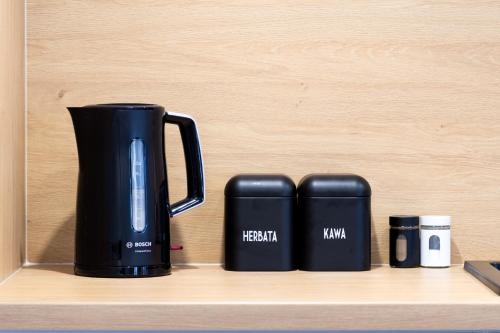 Kemudahan buat kopi dan teh di ApartSatiDeluxe