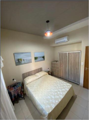 a bedroom with a bed in a room at Costa Rio in Posadas