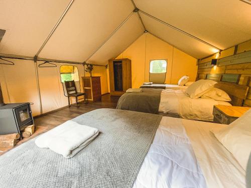 Cama o camas de una habitación en Matapiojo Lodge
