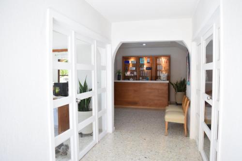 a hallway with white shelves in a room at Costa de Oro Beach Hotel in Mazatlán