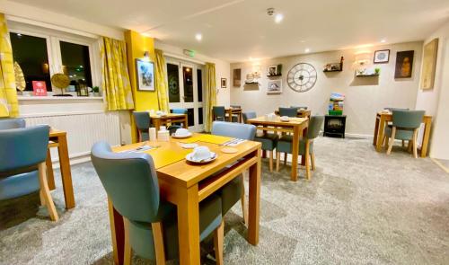 a dining room with a table and chairs at The Ferryboat in Fishguard