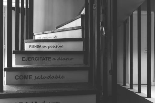 a set of stairs with the words imagine a change at LG Golden Suites in San Miguel de Tucumán