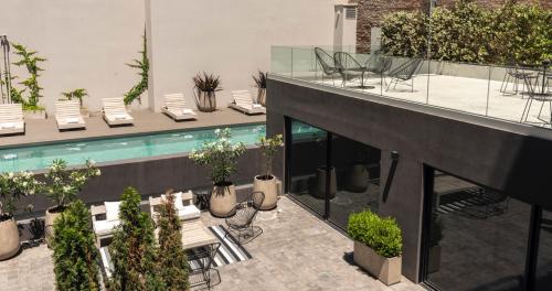 a view of a building with a swimming pool at Krista Boutique Hotel in Buenos Aires