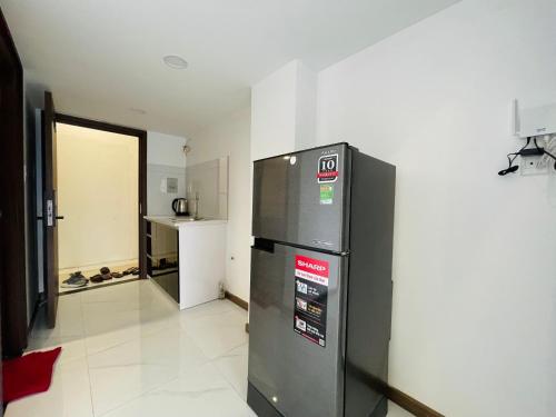 Η κουζίνα ή μικρή κουζίνα στο Smiley Apartment Quận 2