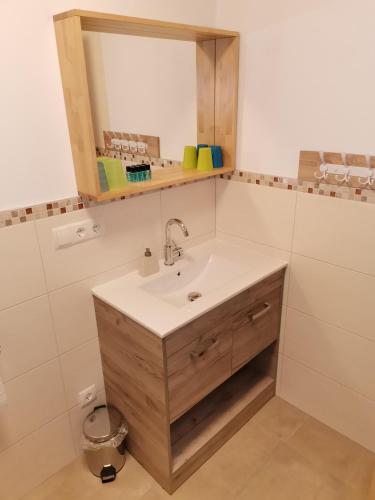 a bathroom with a sink and a mirror at Landhaus Marie in Hermagor