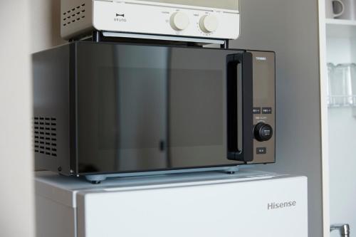 Riverside Hotel Sapporoにあるキッチンまたは簡易キッチン
