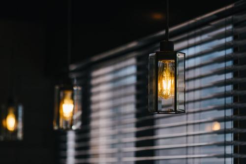 a group of lights hanging from a window at mizuka Business Canal City Hakatamae in Fukuoka