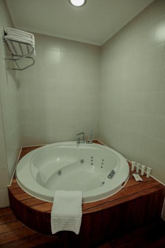 a bathroom with a large tub in a room at Baia Bursa Hotel in Bursa