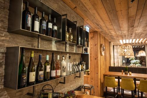 a bar with bottles of wine on the wall at Appartement Tauernblick Radstadt in Radstadt