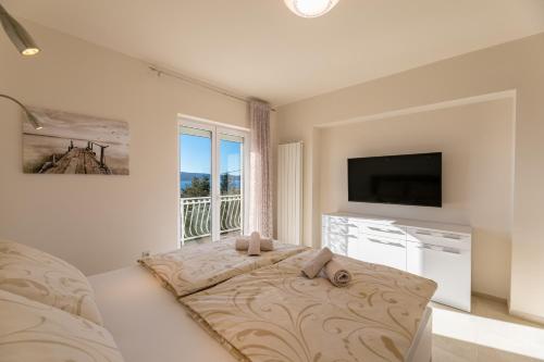 Apartments Abros 객실 침대