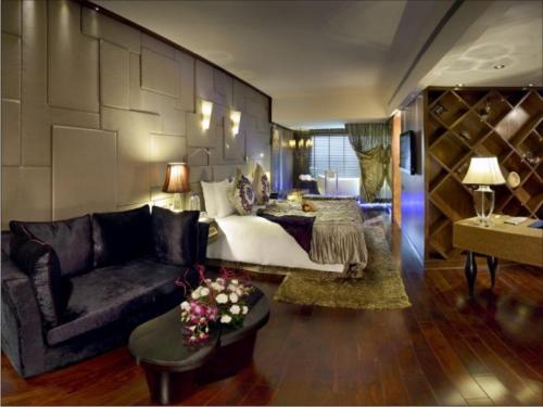 a living room with a couch and a table at Radisson Blu Hotel MBD Ludhiana in Ludhiana