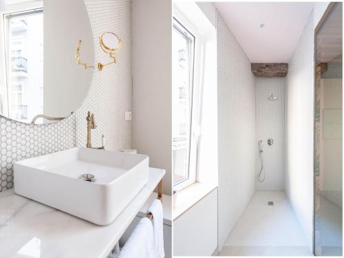 a white bathroom with a sink and a mirror at Urban Suite Santander in Santander