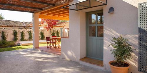 a front door of a house with a patio at La Alberca Casa con jardín y piscina in Tenzuela