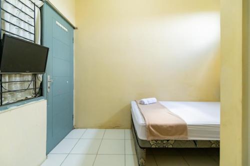 Ένα ή περισσότερα κρεβάτια σε δωμάτιο στο KoolKost @ Rawasari (Minimum Stay 30 Nights)